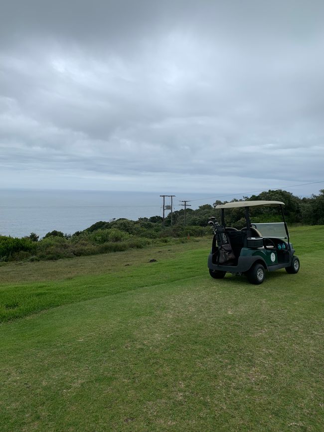 Golf cart with the Atlantic behind