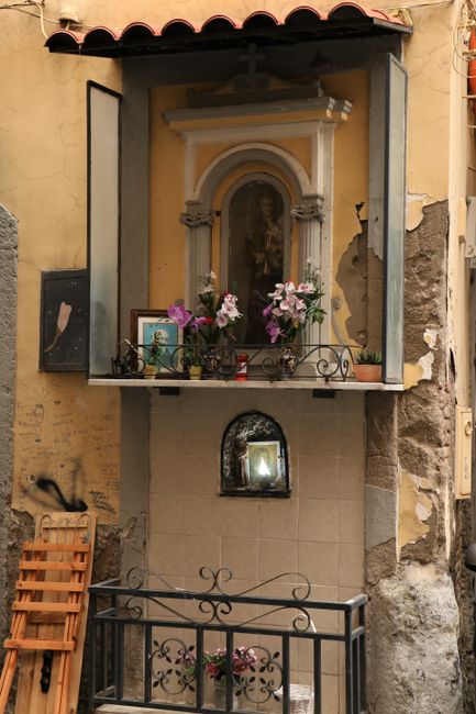 Shrines, crosses, and images of saints are found throughout the city
