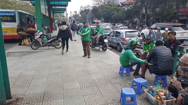 At the bus station, the scooter taxis were already waiting like vultures for customers.