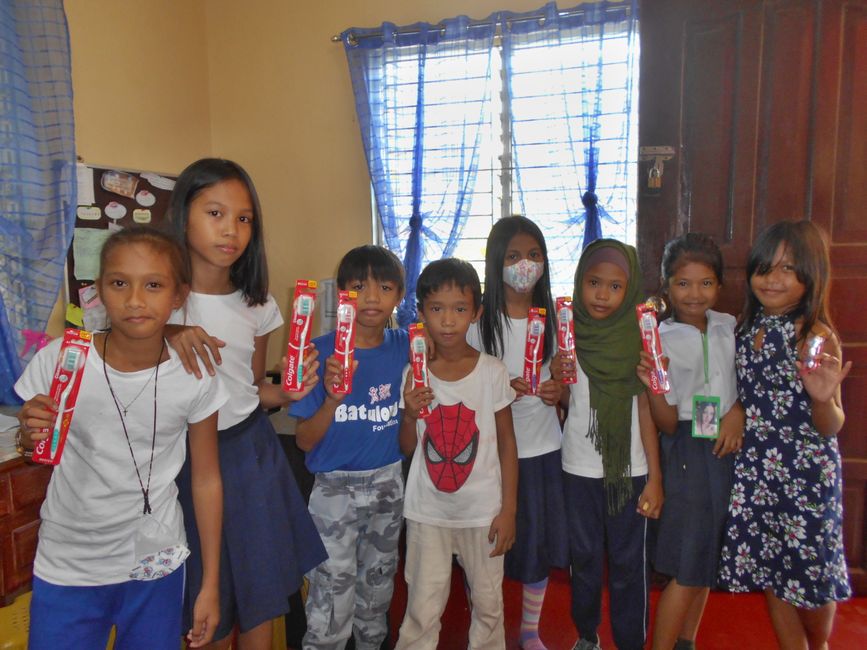 distribution of toothbrushes to all Batulong children