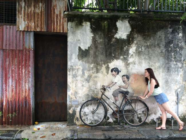 Difficult to capture the street art without posing tourists