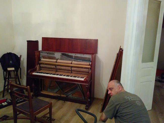 Niko, our piano tuner, raises the piano in our apartment by a whole half tone. Respect!