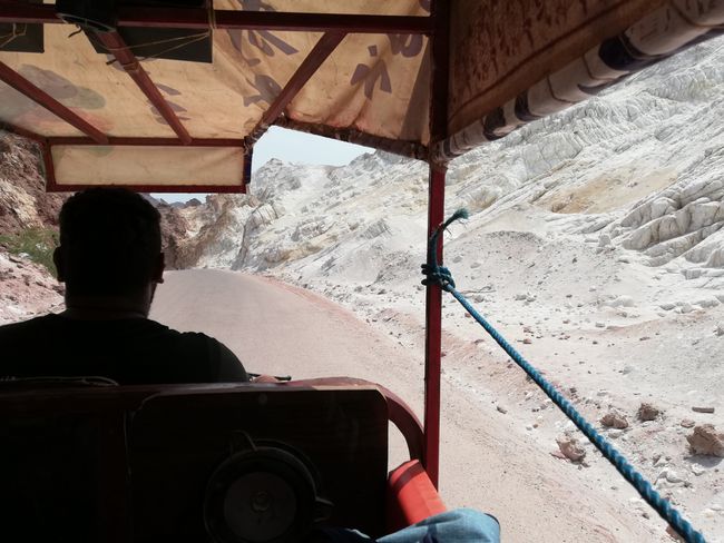Riding in a Tuk-Tuk on Hormoz along huge salt mountains