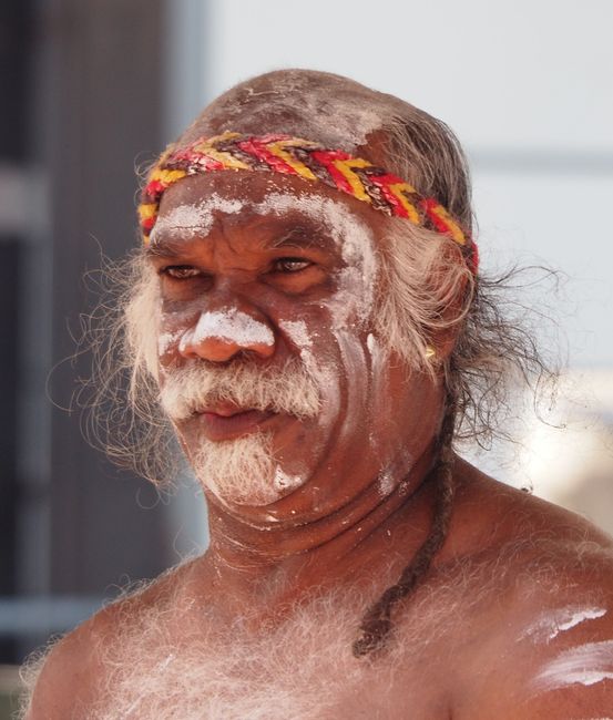 Indigenous person with didgeridoo