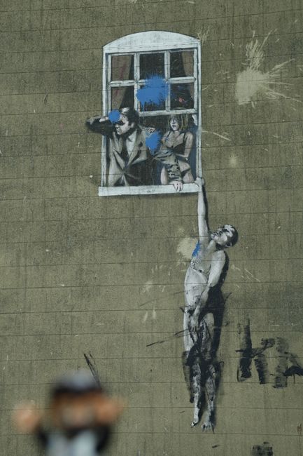 Banksy's Well Hung Lover. This very famous Banksy image was ironically placed on the facade of a Sexual Health Clinic, right across from City Hall.
