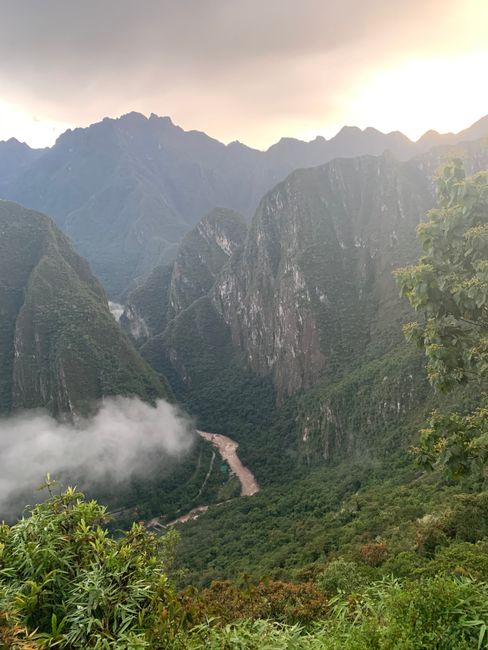 View from Machu Picchu of the surrounding mountains at sunrise