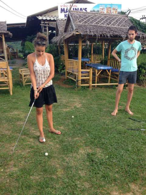 playing mini-golf