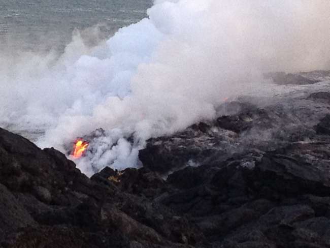Unfortunately, it's very difficult to see in the picture how the lava flows into the sea.