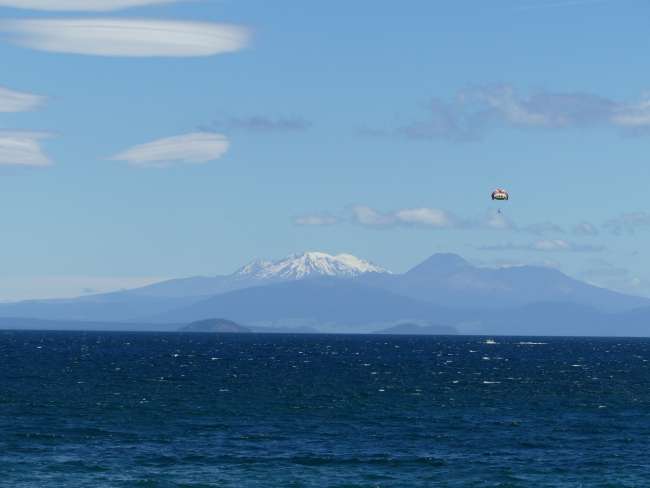 The volcanoes of Tongariro National Park above the lake