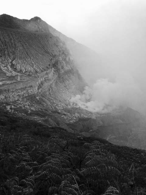View inside the crater of the Ijen volcano with another volcano in the background