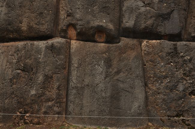 The indentations in the upper stone indicate the lever point for moving the stones