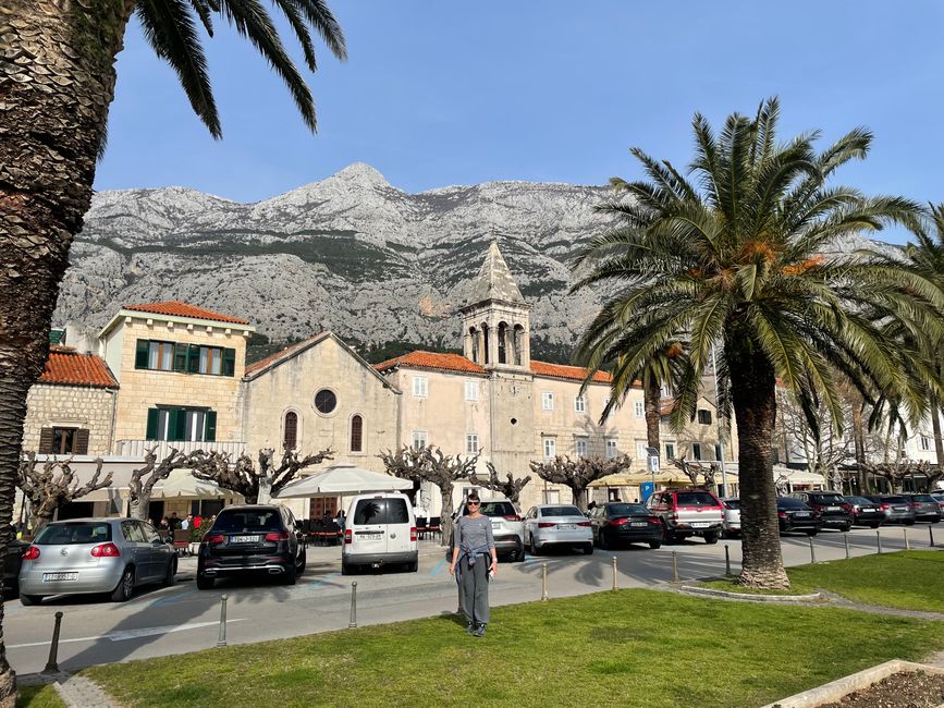 Along the harbor promenade with Mount Sveti Jure in the background