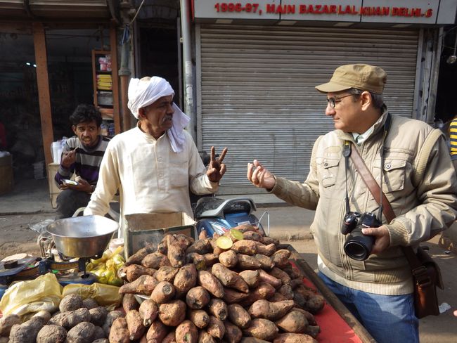 Our humble tour guide in Old Delhi ordering some sweet potato